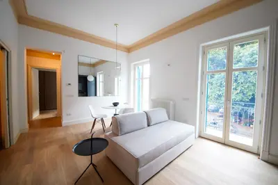 a living room with a white couch and a table at studio 338 in Palermo