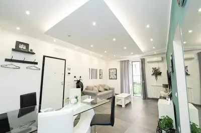 a living room with a couch and a mirror at Modern House Orleans in Palermo