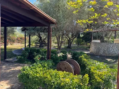 a garden with a pavilion and some bushes and trees at Villa Il Giardino di Rosa- 5 Min from the sea-Fraginesi in Castellammare del Golfo