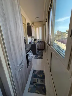 a narrow hallway in a room with a window at Casa Basile in Palermo