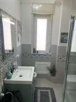 a bathroom with a sink and a shower at Casa Basile in Palermo