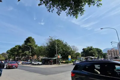 a busy city street with cars parked on the road at home indipendenza 2 in Palermo