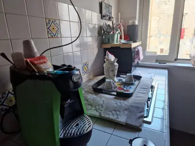 a kitchen with a hair dryer sitting on a counter at home indipendenza 2 in Palermo