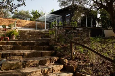 a set of stone stairs leading to a house at Spera Luxury in Monreale