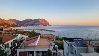a view of the ocean from a city at Villa Maurino by DomuSicily in Mondello