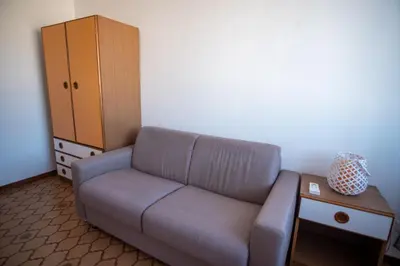 a living room with a couch and a table at Mondello SunSea in Mondello