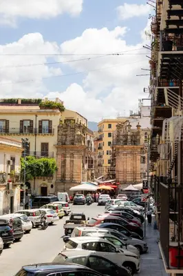 a city street with cars parked in a parking lot at Platinum Suite&Spa in Palermo