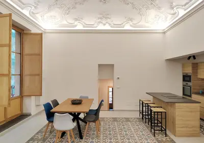 a dining room with a table and chairs at Ciuririvù in Palermo