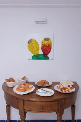 a table with plates of food on top of it at Piano Alloro in Palermo