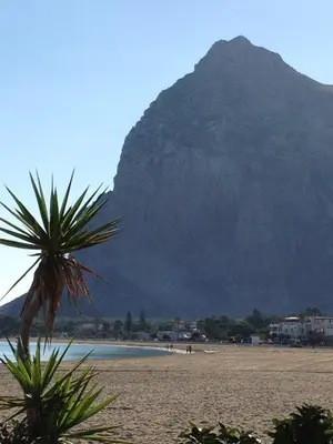a view of a beach with a mountain in the background at Aurora e Andrea San Vito lo Capo in San Vito lo Capo