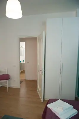 a room with a door open to a room with a bed at Casa Vacanze Ines in Carini