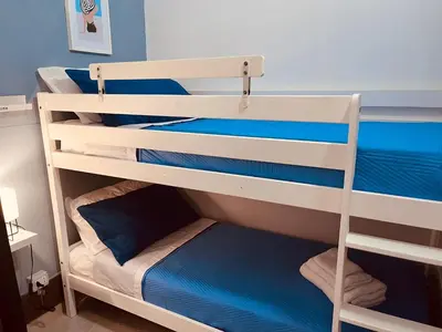 a couple of bunk beds in a room at Casa di DaFe-Casa Vacanze in Castellammare del Golfo