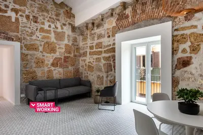 a living room with a couch and a table at Casa Design tra le Mura by Wonderful Italy in Palermo