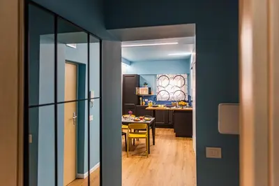 a kitchen with a table and a dining room at Le Carte in Castellammare del Golfo