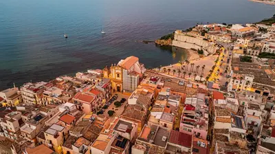 an aerial view of a city next to the water at Le Carte in Castellammare del Golfo