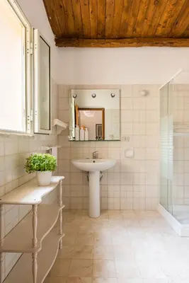 a bathroom with a sink and a mirror at Villa Ammirata Mondello by Wonderful Italy in Mondello