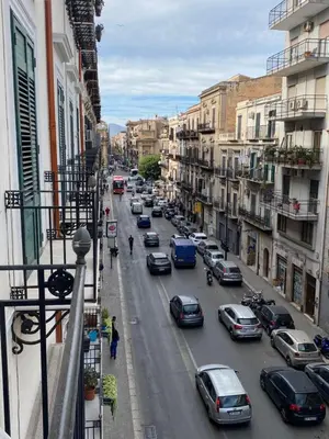 a city street filled with lots of cars at Case Vacanza ORETO in Palermo