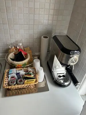 a kitchen counter with a tray of food and a toaster at Costanza House in Palermo