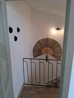 a hallway with an umbrella on the wall at Donna Carmela in Porticello