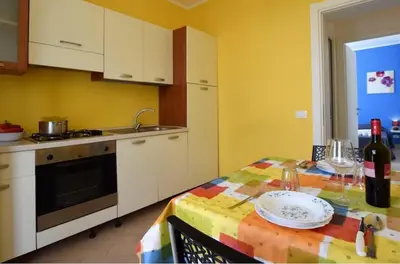 a kitchen with a table with a plate on it at Villa La Palmetta a San Vito lo capo in San Vito lo Capo