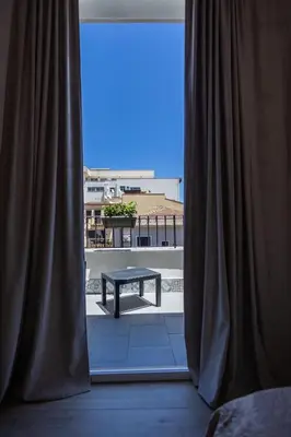 a view of a table from a window at Mangano Suites in Palermo