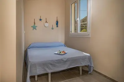 a room with a bed with a tray of food on it at Villa Spada con ampi spazi esterni in San Vito lo Capo