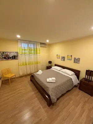 a bedroom with a bed with two towels on it at Casa Amarilla in Palermo