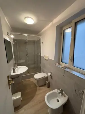 a bathroom with a sink and a toilet and a shower at Casa Amarilla in Palermo