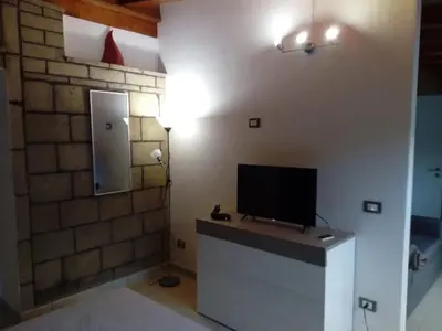 a room with a tv on top of a counter at Loft Mondello Beach in Palermo