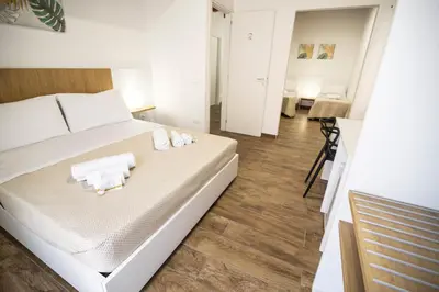a bedroom with a bed with towels on it at Quattro Canti in Carini