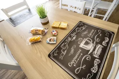 a table with a chalk board with food on it at Quattro Canti in Carini