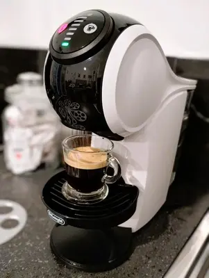 a coffee maker is making a cup of coffee at Domus Vetriera in Palermo