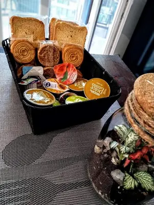 a tray of food with sandwiches and bread on a table at Domus Vetriera in Palermo