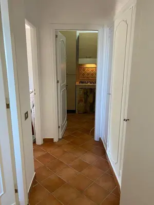 a hallway with a kitchen with a tiled floor at PANORAMIC VIEW - Sabrina's house in Altavilla Milicia