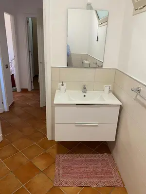 a bathroom with a sink and a mirror at PANORAMIC VIEW - Sabrina's house in Altavilla Milicia