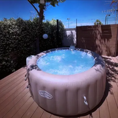 a large hot tub sitting on a wooden deck at Chalet Seaview by AR Group Hotels in Isola delle Femmine