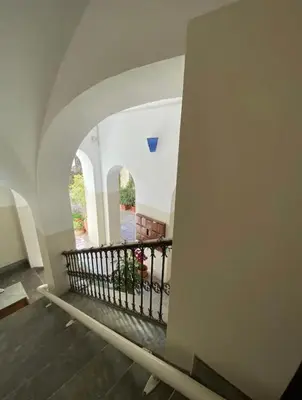 a view of a hallway of a building with a balcony at Calvello studio apartment in Palermo