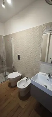 a bathroom with a toilet and a sink at Profumo di casa in Lascari