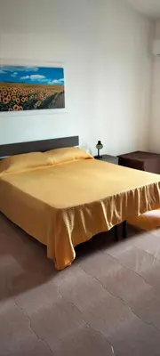 a bed in a room with a bedspread on it at Villa Rosa Bella Vista Balestrate in Balestrate