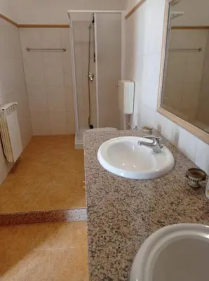 a bathroom with a white sink and a shower at Villa Rosa Bella Vista Balestrate in Balestrate