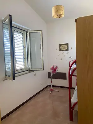 a room with a room with a bed and a window at Villa Rosa Bella Vista Balestrate in Balestrate