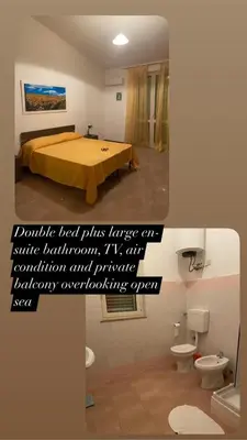 a room with a bed and a bathroom with toilets at Villa Rosa Bella Vista Balestrate in Balestrate