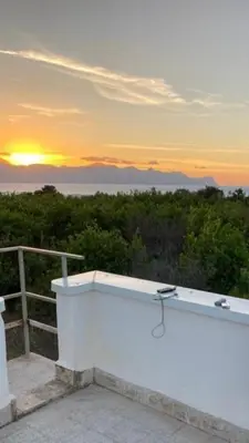 a bath tub with the sunset in the background at Villetta indipendente a Balestrate in Balestrate