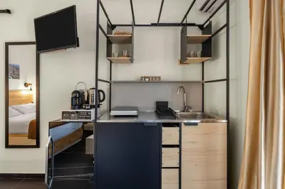a kitchen with a counter and a sink in a room at Al Borghetto marinaro in Palermo