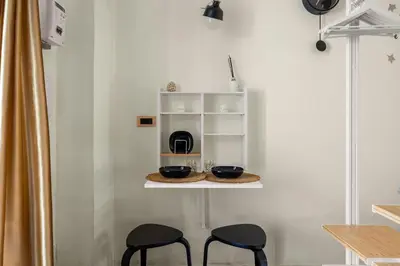 a room with two chairs and two bowls on a shelf at Al Borghetto marinaro in Palermo