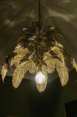 a chandelier with a plant hanging from a ceiling at Le radici di Gallidoro in Palermo