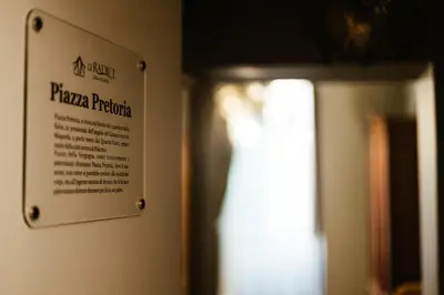 a sign on a wall next to a door at Le radici di Gallidoro in Palermo