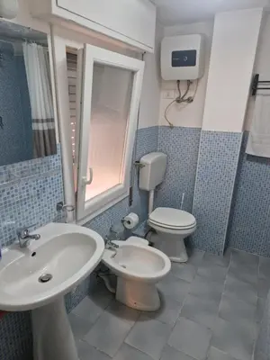 a bathroom with a sink and a toilet at Gianni House Palermo in Palermo