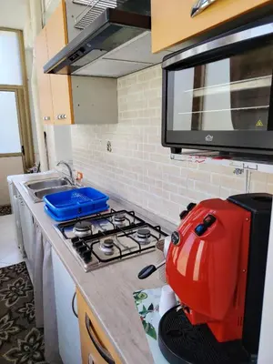 a kitchen with a red appliance on a counter at A casa di Livia in Villabate