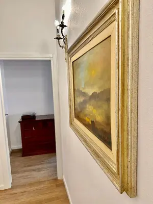 a bedroom with a white bed and a couch at Kalsa Baroque Apartment in Palermo